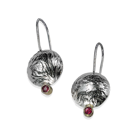Textured reticulated silver with red rubies. The earrings feels like soft tree bark.
