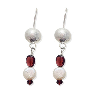 Earrings with red garnets, disc shaped silver and coin shaped pearls.