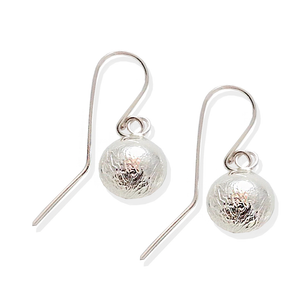 Textured reticulated silver circles with sterling ear wires.   Textured and silky.
