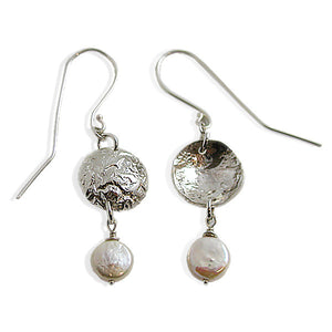 Textured reticulated silver metal with smooth coin shaped pearls.    