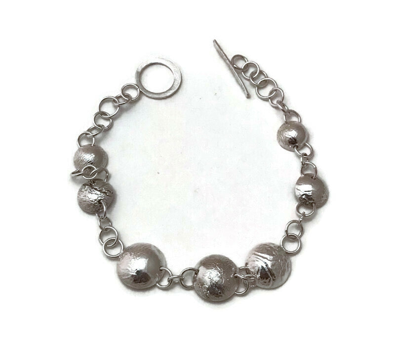 Sterling and reticulated silver bracelet that is textured and smooth all at the same time.   One-of-a-kind.